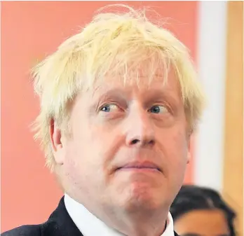  ??  ?? > Prime Minister Boris Johnson bid in an auction during a visit to Scotland – Q1