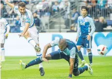  ?? RIC ERNST ?? Whitecaps centre back Kendall Waston, centre, couldn’t stop the Montreal Impact’s Ignacio Piatti in the 2016 MLS season opener.