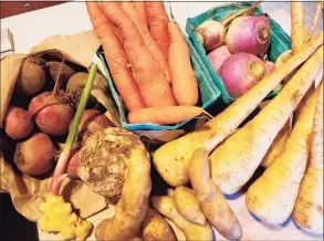  ?? Frank Whitman / For Hearst Connecticu­t Media ?? Turnips, parsnips, celeriac, and rutabagas along with freshly dug potatoes and ginger from the Westport Farmers Market.