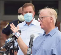  ?? H John Voorhees III / Hearst Connecticu­t Media ?? Former Danbury Mayor Mark Boughton, shown last August with Gov. Ned Lamont in the background, has been approved by the state House to lead Connecticu­t’s Department of Revenue Services.