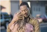  ?? Darren Michaels Cinelou Films ?? EDDIE MURPHY, with Britt Robertson, plays a cook in “Mr. Church.”