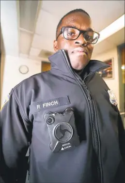  ?? Hearst Connecticu­t Media file photo ?? New Haven police officer Paul Finch was one of the first officers to be given a body camera to test new features in the fall of 2017.