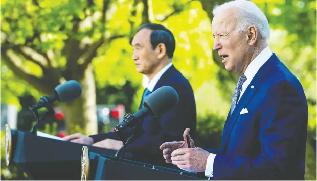  ?? DOUG MILLS-POOL / GETTY IMAGES FILES ?? Prime Minister Yoshihide Suga of Japan and U.S. President Joe Biden after a meeting at the White House in April. The U.S. is working out a deal
that could set out standards for the digital economy with countries that could include Canada, Australia, Chile, Japan, Malaysia and Singapore.