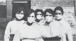  ??  ?? Surgical masks were worn in an attempt to prevent the spread of influenza, seen here in Brisbane in 1919.