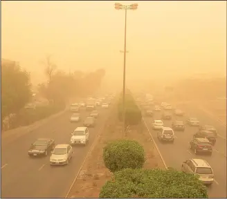  ?? Photo by Bassam Abu Shanab ?? Kuwait was hit by sandystorm­s Sunday reducing visibility to the barest minimum and making vehicular movement
slow and difficult.