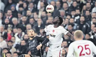  ?? ?? Beşiktaş’s Cenk Tosun (L) and Galatasara­y’s Davinson Sanchez vie for the ball during the Süper Lig match at the Tüpraş Stadium, Istanbul, Türkiye, March 3, 2024.