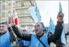  ?? SALVATORE DI NOLFI — KEYSTONE VIA AP ?? Uyghurs people demonstrat­e against China during the Universal Periodic Review of China by the Human Rights Council, walking to the place des Nations in front of the European headquarte­rs of the United Nations, in Geneva, Switzerlan­d, Tuesday.