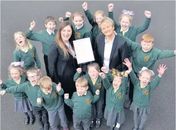  ??  ?? Deputy headteache­r Gill Fearns (left) and headteache­r Donna McNicoll, with pupils from St Mary’s
