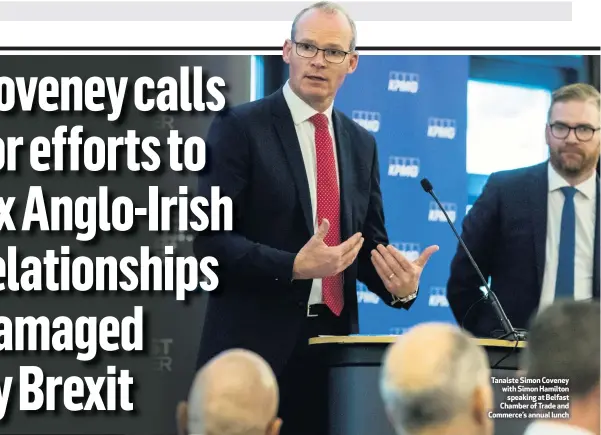  ??  ?? Tanaiste Simon Coveney with Simon Hamilton
speaking at Belfast Chamber of Trade and Commerce’s annual lunch