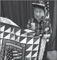  ?? Submitted photo ?? QUILT OF VALOR: Robert Palis, a World War II submarine veteran and a regular at Evening Bingo, with his Quilt of Valor. Photo courtesy of Leanne Cunningham.