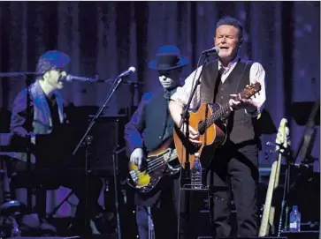  ?? Katie Falkenberg Los Angeles Times ?? DON HENLEY and friends perform at the Forum, where his show skewed country and included surprises.