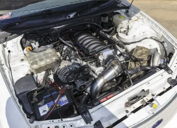  ?? ?? ENGINE: While the internet jokes about the similariti­es between LS and Windsor V8s, it is surprising how well the GM donk fits in the front of the all-aussie Falcon; it even retains the standard AU radiator and thermo fans!