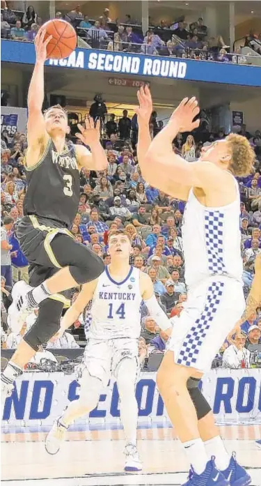  ?? GETTY ?? Wofford’s Fletcher Magee didn’t get many easy looks against Kentucky on Saturday night.