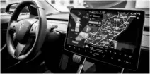  ?? PHOTO: BLOOMBERG ?? Tesla’s cars use a giant ipad-like screen instead of physical controls, and customers can use a smartphone as their key