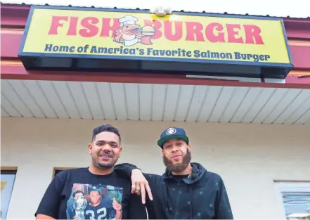  ?? PHOTOS BY ALIE SKOWRONSKI/COLUMBUS DISPATCH ?? Randy Keyes, left, and Demetrius Howard have opened Fishburger on East Livingston Avenue. The restaurant is carryout-only for now.