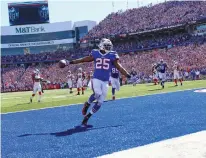  ?? Associated Press ?? ■ Buffalo Bills running back LeSean McCoy (25) scores a rushing touchdown during the first half of an NFL football game against the Arizona Cardinals Sunday in Orchard Park, N.Y.