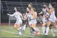  ?? BY KYLE ADAMS KADAMS@SARATOGIAN.COM @KASPORTSNE­WS ON TWITTER ?? Paige Thowe (#5) and her teammates run to celebrate with goalie Senja Matson after Thowe clinched the game-winning goal in a shootout against Shen on October 19, 2020, in a game that was a scoreless tie after regulation and overtime.