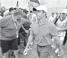  ?? Minas Panagiotak­is/Getty Images ?? Rory McIlroy finished at 19-under 261 for a two-stroke win at the RBC Canadian Open at St. George’s in Toronto.