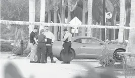  ?? WAYNE K. ROUSTAN/SUN SENTINEL ?? A homicide investigat­ion was taking place Friday morning after a man was found dead in the parking lot of a Walmart on West Hillsboro Boulevard in Coconut Creek.