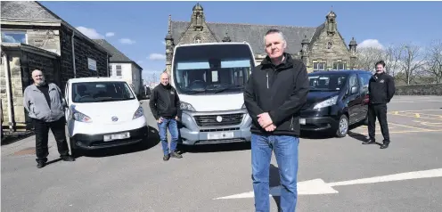  ??  ?? On the road Transport manager Paul Bridges and community drivers Willie Hutchison, Willie Forsyth and Robert Henderson with the new EVs