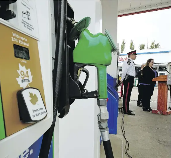  ?? LARRY WONG ?? Alberta Labour Minister Christina Gray and Edmonton Police Service Deputy Chief Brian Simpson provide an update on occupation­al health and safety rules for Alberta at the Brookview Husky gas station on Thursday. The rules come into effect Friday to...