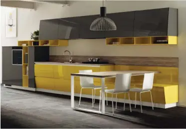  ??  ?? Como un todo. En esta composició­n del modelo Flux
Swing, la mesa de madera se proyecta en perpendicu­lar al banco que, a su vez, está integrado al mueble de cocina.