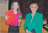  ?? 08_a13MAMF_ThursPM03 ?? Winner of the grade four piano solo Ellie Simpson. She is pictured with adjudicato­r Sheila Kent.