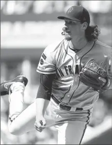  ?? BRIAN CASSELLA/TRIBUNE NEWS SERVICE ?? Giants starter Jeff Samardzija pitches in the sixth inning of a 1-0 loss against the Chicago Cubs on August 22, 2019, at Wrigley Field in Chicago.