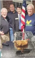  ?? CONTRIBUTE­D PHOTO ?? From left, Jack McLemore, Jimmy Gray, state Rep. Mitchell Horner and Joel Rawlston. McLemore is the owner of the hen, named Dolly, brought to Tuesday night’s Catoosa County Board of Commission­ers meeting.