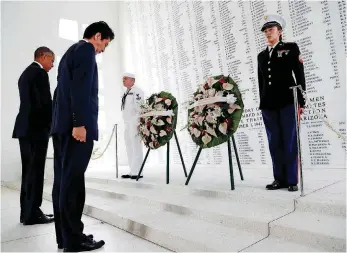  ?? [AP PHOTO] ?? PHOTO: President Barack Obama and Japanese Prime Minister Shinzo Abe participat­e in a wreathlayi­ng ceremony Tuesday at the USS Arizona Memorial in Joint Base Pearl Harbor-Hickam, Hawaii.