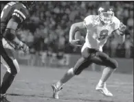  ?? Democrat-Gazette file photo ?? Arkansas freshman quarterbac­k Matt Jones rushed for 110 yards in the victory over Ole Miss in 2001. He ran for two touchdowns, passed for another and completed a pair of two-point conversion passes — all in the overtime periods.