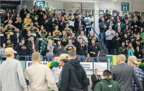  ?? LIAM RICHARDS ?? Many former Broncos arrived in Humboldt to show support and attend the team’s season opener Wednesday night. Above, fans participat­e in the game’s opening ceremonies against the Nipawin Hawks.