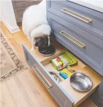  ?? ?? Designers like Atlanta-based Lisa Brooks add clever features like an in-drawer pet feeding station in a kitchen.