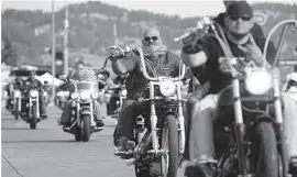  ?? AP Photo ?? More than 400,000 bikers gathered in Sturgis last summer and while there may not be that many when the 10-day event begins Aug. 7, there will be large numbers of bikers potentiall­y bringing COVID-19 to the event or taking it home with them.