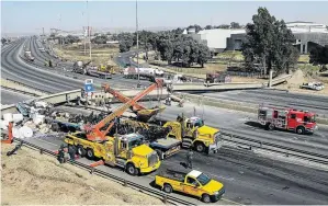  ??  ?? A pedestrian bridge collapsed on to the N3 highway near Germiston on the East Rand recently. Five people were injured.