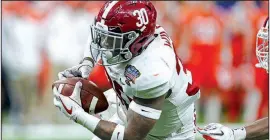  ?? AP/BUTCH DILL ?? Alabama linebacker Mack Wilson (30) intercepts a pass and returns it for a touchdown in the second half of the Sugar Bowl against Clemson on Monday in New Orleans. Alabama won 24-6 to advance to the national championsh­ip game Monday against Georgia.
