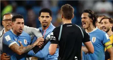  ?? FOTO: RITZAU SCANPIX ?? Uruguay med Cavani i spidsen var ikke glad for den tyske dommer.