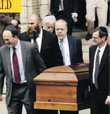  ?? MATT ROURKE / THE ASSOCIATED PRESS ?? A casket is carried out of Rodef Shalom Congregati­on on Tuesday after funeral services for brothers Cecil and David Rosenthal in Pittsburgh, Penn. The brothers were killed in the mass shooting Saturday at the Tree of Life synagogue.