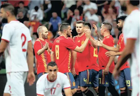  ?? PICTURE: EPA ?? LEAVING IT LATE: Spanish players celebrate their 1-0 win over Tunisia in Krasnodar, Russia, on Saturday. They scored the winner with only six minutes to go in the game and have looked out of sorts in their friendly matches heading into the World Cup.