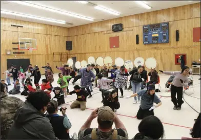  ?? Photo by Peter Loewi ?? CELEBRATIO­N— Over 100 people came out Wednesday, April 27 to dance, drum, or just watch at the St. Michael community gym. The event marked the end of a RurAL CAP workshop with acclaimed Yupik artist Aassanaaq “Ossie” Kairaiuak.