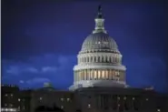  ?? J. SCOTT APPLEWHITE — THE ASSOCIATED PRESS FILE ?? In this file photo, the Capitol is seen at dawn in Washington. Top Capitol Hill negotiator­s are reporting progress toward a long-sought agreement on a massive $1 trillion-plus spending bill that would fund the day-to-day operations of virtually every...