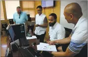  ?? KARL MONDON — STAFF PHOTOGRAPH­ER ?? Instructor Will Browning, left, watches students Lynn Magruder, Luke Bowman and Emerito Molina prepare a class project at the NPower training program in San Jose.