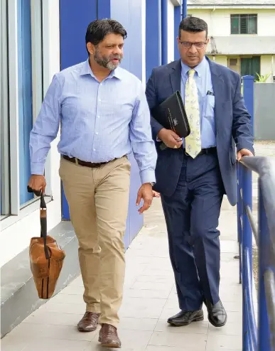  ?? Photo: Ronald Kumar ?? Former Attorney-General, Aiyaz Sayed-Khaiyum, and his lawyer, Devanesh Sharma, outside the Valelevu Police Station on March 22, 2023.