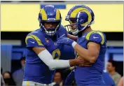  ?? AP PHOTO BY MARK J. TERRILL ?? Los Angeles Rams wide receiver Cooper Kupp, right, celebrates his touchdown catch with quarterbac­k Matthew Stafford during the second half of an NFL football game against the Jacksonvil­le Jaguars Sunday, Dec. 5, in Inglewood.