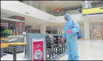  ?? GURMINDER SINGH//HT ?? A worker decked in PPE suit sanitising VR Punjab mall, a day before its opening, in Mohali on Sunday.