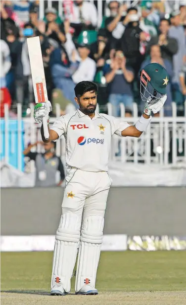  ?? Agence France-presse ?? Pakistan’s captain Babar Azam celebrates after scoring a century during the third day of the fi rst T est match against England in Rawalpindi on Saturday.