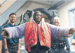  ?? JUSTIN GREAVES TORSTAR ?? Youth In Policing Initiative student Aaliyah Wright tries on a bite suit for dog training at the Toronto Police Dog Services unit in East York.