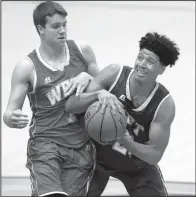  ?? Arkansas Democrat-Gazette/STATON BREIDENTHA­L ?? East guard Marquis Eaton (right) of Jonesboro drives and is fouled by West defender Matthew Wilson of Farmington in Thursday’s Arkansas High School Coaches Associatio­n All-Star boys basketball game at the Farris Center in Conway. Eaton had 11 points,...