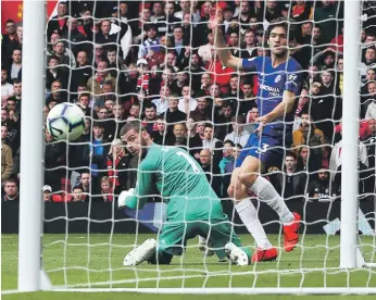  ?? EPA ?? Chelsea’s Marcos Alonso finishes past Manchester United goalkeeper David de Gea