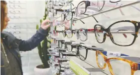  ?? DENIS CHARLET / AFP VIA GETTY IMAGES ?? A Vancouver couple that sells glasses and contact lenses are falling just short of the
qualificat­ion to gain a rent subsidy from the federal government.